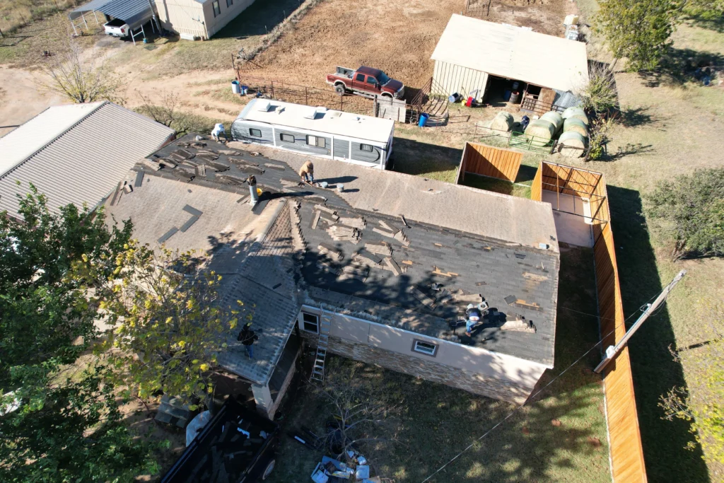 Aerial view of residential roof replacement in progress