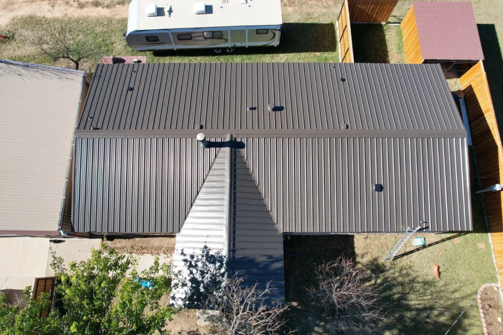 Top-down view of a completed metal roof installation